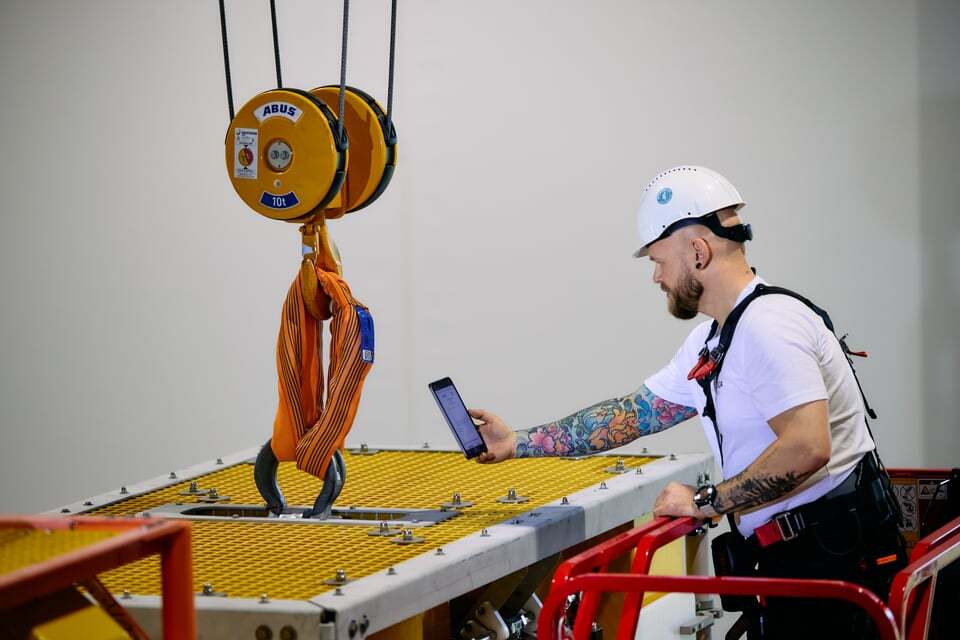 a worker using Onix Work to access equipment information